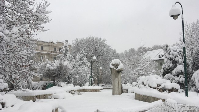 A very wintery scene in Sarajevo, showing a snow covered public space
