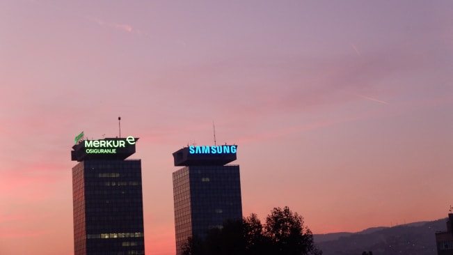 The twin skyscrapters that are called UNITIC with a sunset backdrop